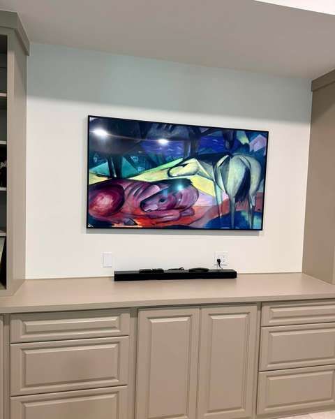 TV centered over built-in cabinets